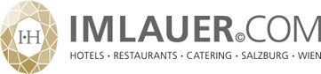 Goldenes ovales Logo mit schwarzem Schriftzug von Imlauer Hotels und Restaurants